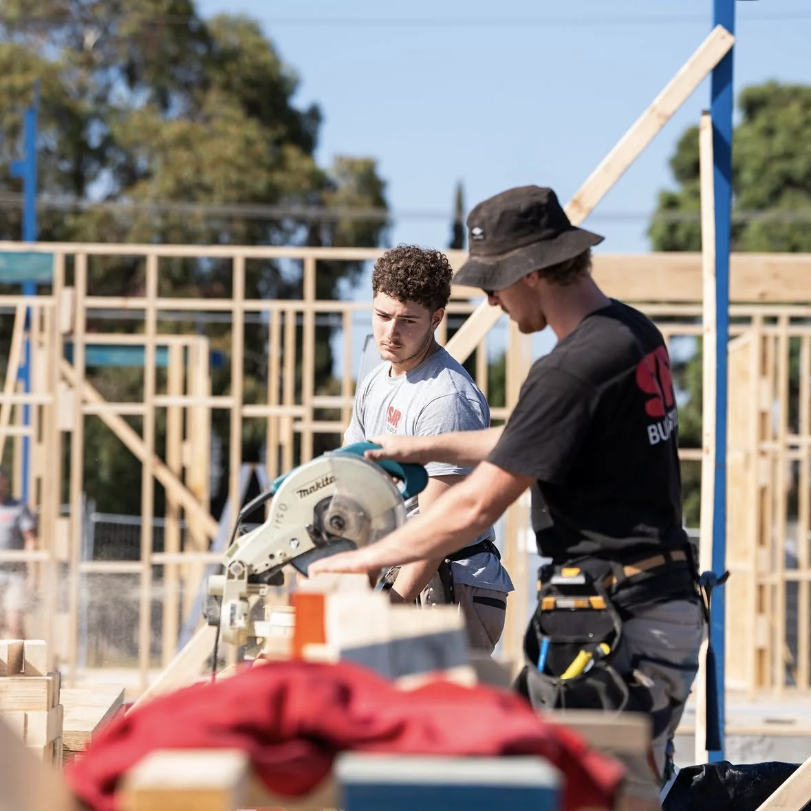 SJR carpenters working with a circular saw on a residential timber frame